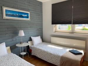 Postel nebo postele na pokoji v ubytování Celic Art Apartments
