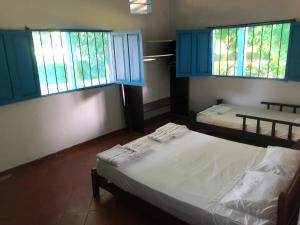 Un pat sau paturi într-o cameră la Finca del Rio Palomino