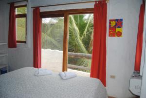 Voodi või voodid majutusasutuse Hostal Galapagos by Bar de Beto toas