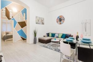 a living room with a couch and a table at Grand Budapest Apartments in Budapest