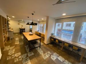 a kitchen with a table and chairs in a room at Piano Hotel in İzmir