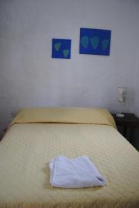 Voodi või voodid majutusasutuse Hostal Galapagos by Bar de Beto toas