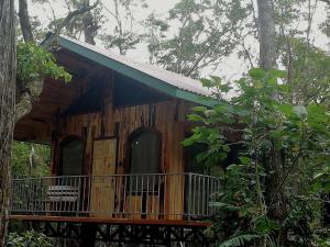 a tree house in the middle of a forest at Monteverde Romantic Cottage in Monteverde Costa Rica