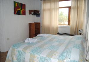 Voodi või voodid majutusasutuse Hostal Galapagos by Bar de Beto toas