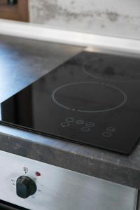 a close up of a toaster oven with a phone on it at Alexandros Hotel Apartments in Vourvourou
