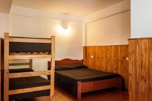 Een bed of bedden in een kamer bij La Neofita