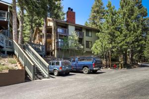 two vehicles parked in front of a house at Hidden Valley Condominiums in Mammoth Lakes