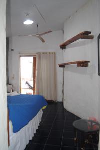 Voodi või voodid majutusasutuse Hostal Galapagos by Bar de Beto toas
