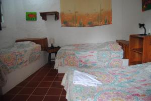 Voodi või voodid majutusasutuse Hostal Galapagos by Bar de Beto toas