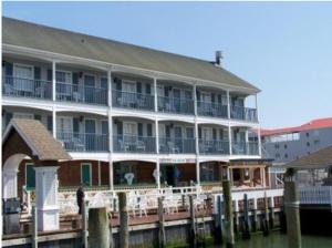 a large building with a large window overlooking a body of water at Talbot Inn in Ocean City
