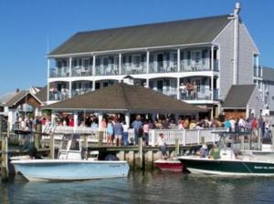 a large building with boats docked at a dock at Talbot Inn in Ocean City