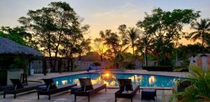 The swimming pool at or close to Pousada Recanto dos Passaros