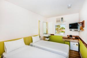 Postel nebo postele na pokoji v ubytování ibis Budget - Dandenong + 14 fotografií