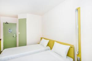 Postel nebo postele na pokoji v ubytování ibis Budget - Dandenong