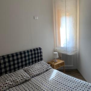מיטה או מיטות בחדר ב-Appartamento sirente
