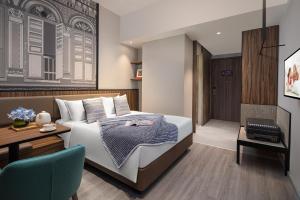 Citadines Rochor Singapore客房内的一张或多张床位