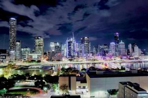 a view of a city skyline at night at Lucid Apartment South Brisbane in Brisbane