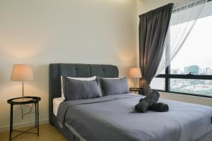 Postel nebo postele na pokoji v ubytování USJ One Subang Jaya by Widebed