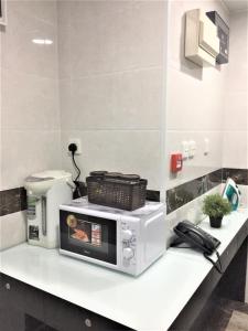 Eldhús eða eldhúskrókur á Metrocity Lounge