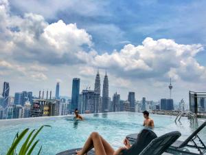 a infinity pool on the roof of a skyscraper at WGS Suites at KLCC, 300Mbps WiFi in Kuala Lumpur