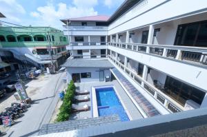 an overhead view of a building with a swimming pool at Coconut Grove Hotel Samui in Chaweng