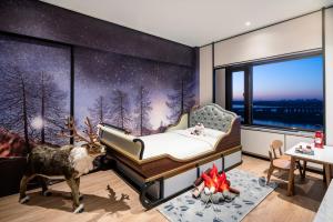 Postel nebo postele na pokoji v ubytování Shangri-La Harbin