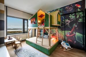 Postel nebo postele na pokoji v ubytování Shangri-La Harbin