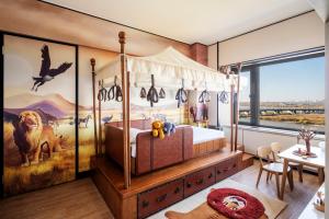 Postel nebo postele na pokoji v ubytování Shangri-La Harbin