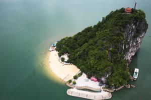 an island in the water with a beach at Chiến Thắng victory hotel in Ha Long