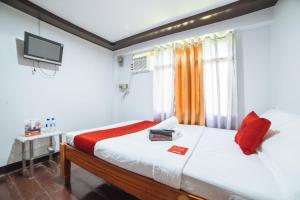 Ένα ή περισσότερα κρεβάτια σε δωμάτιο στο RedDoorz near San Juanico Bridge