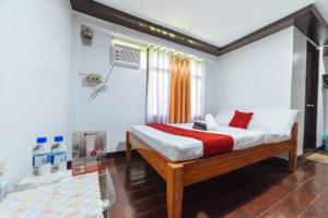 Ένα ή περισσότερα κρεβάτια σε δωμάτιο στο RedDoorz near San Juanico Bridge