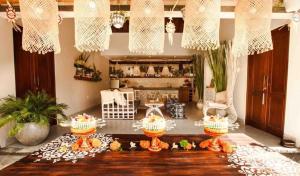 a room with a table with cakes on it at Villa Sarong 2 in Seminyak