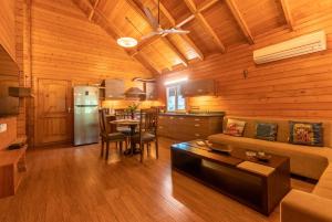 Posezení v ubytování Nature's Abode - The Wooden Villa at Morjim by StayVista