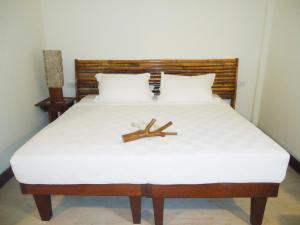 Tempat tidur dalam kamar di Naya Gawana Resort & Spa