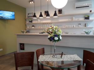 A television and/or entertainment centre at Konačište Grad B&B