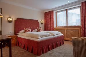 En eller flere senge i et værelse på Hotel Erzberg