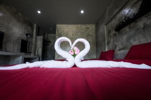 The Loft House Sakaeo客房内的一张或多张床位