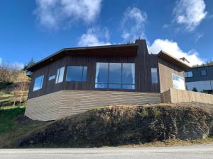 a wooden house on top of a hill at GoldRush Haven in Queenstown