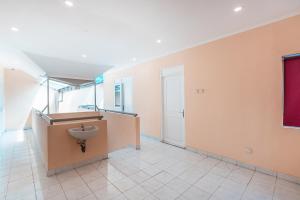 a bathroom with a sink and a toilet at RedDoorz @ Pavilion Residence Cikarang in Jakarta