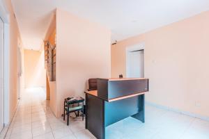 a bathroom with a sink and a mirror at RedDoorz @ Pavilion Residence Cikarang in Jakarta