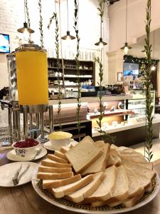 a plate of bread on a table in a store at Kimberley Hotel Georgetown in George Town