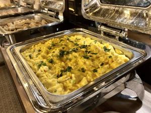 a casserole dish of food in a buffet at Kimberley Hotel Georgetown in George Town