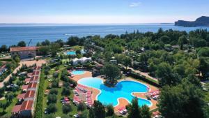 an aerial view of a resort with a swimming pool at Fornella Camping & Wellness family resort in San Felice del Benaco