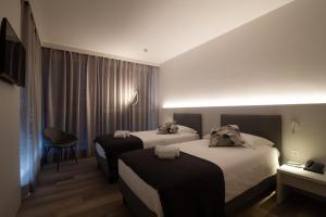 Hotel Albergo Milano客房内的一张或多张床位