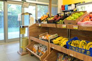 a produce section of a store with fruits and vegetables at Fornella Camping & Wellness family resort in San Felice del Benaco