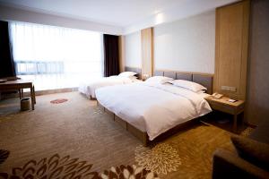 Postel nebo postele na pokoji v ubytování Metropark Hotel Yingkun Beijing