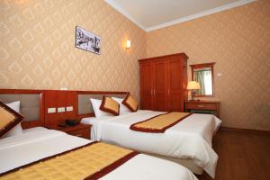 Letto o letti in una camera di ATS Hotel