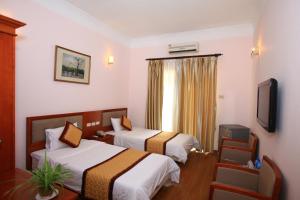 Letto o letti in una camera di ATS Hotel