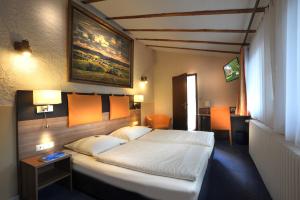 Giường trong phòng chung tại Römerhof