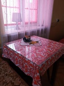 a table with a plate of food on top of it at ZА in Khmelnytskyi